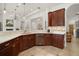 Gourmet kitchen features custom cabinetry, granite countertops, tile backsplash and stainless steel appliances at 38716 Oak Place Ct, Lady Lake, FL 32159