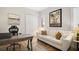 Home office with couch, desk, accent art and bright natural light at 38716 Oak Place Ct, Lady Lake, FL 32159