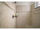 Shower stall featuring neutral ceramic tile with matching accent border and built in shower bench at 38716 Oak Place Ct, Lady Lake, FL 32159
