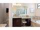 Modern bathroom features a spacious vanity, walk-in shower, and granite countertops at 39505 Hillrise Ln, Lady Lake, FL 32159
