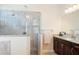 Elegant bathroom showcasing a glass shower, granite counters, and sleek cabinetry at 39505 Hillrise Ln, Lady Lake, FL 32159