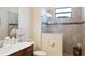 Elegant bathroom featuring a glass-enclosed shower, sleek fixtures, and neutral tile at 39505 Hillrise Ln, Lady Lake, FL 32159