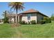 Well-maintained lawn and landscaping surrounding a neutral home, complemented by a clear, sunny sky at 39505 Hillrise Ln, Lady Lake, FL 32159