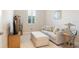 Inviting living room showcasing a plush sofa, ottoman, and a display cabinet at 39505 Hillrise Ln, Lady Lake, FL 32159