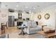 Open-concept living room with stainless steel appliances, large island, and neutral tones providing a luxurious and inviting space at 39505 Hillrise Ln, Lady Lake, FL 32159