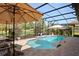 Enjoy the sparkling pool with lounge chairs and lush landscaping for a private oasis in your backyard at 39505 Hillrise Ln, Lady Lake, FL 32159
