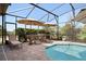 A pristine in-ground pool offers a refreshing escape, surrounded by manicured landscaping and privacy at 39505 Hillrise Ln, Lady Lake, FL 32159