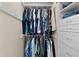 Walk-in closet with organized clothing racks and shelving for ample storage at 411 Loma Paseo Dr, The Villages, FL 32159