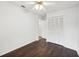 Bedroom with hardwood floors, a ceiling fan, and closet space at 4145 Dora Wood Dr, Mount Dora, FL 32757
