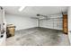 Spacious garage with concrete floors and an automatic door at 4145 Dora Wood Dr, Mount Dora, FL 32757