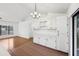 Kitchen view highlighting access to the living room with lots of cabinets and countertop space at 4145 Dora Wood Dr, Mount Dora, FL 32757