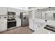 Updated kitchen features stainless appliances and generous counter space for cooking and entertaining at 4145 Dora Wood Dr, Mount Dora, FL 32757