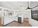 Updated kitchen with stainless appliances and granite counters is open to the living area at 4145 Dora Wood Dr, Mount Dora, FL 32757
