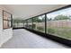 This is a screened patio overlooking the backyard at 4145 Dora Wood Dr, Mount Dora, FL 32757