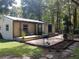 Cozy home featuring a spacious wooden deck, perfect for outdoor entertaining and relaxation at 4746 Cr 300, Lake Panasoffkee, FL 33538
