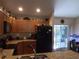 Functional kitchen featuring granite countertops, ample cabinet space, and modern black appliances at 4746 Cr 300, Lake Panasoffkee, FL 33538