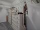 Organized walk-in closet featuring ample shelving and drawer space for storage at 507 Torres Pl, The Villages, FL 32159