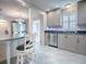 Modern kitchen featuring stainless steel appliances, marble countertops, and tile floors at 507 Torres Pl, The Villages, FL 32159