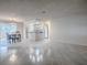 Open living space features tile flooring and recessed lighting, creating a bright and airy atmosphere at 507 Torres Pl, The Villages, FL 32159