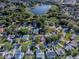 This is an aerial view of the property showing it is near a lake and golf course at 507 Torres Pl, The Villages, FL 32159