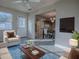 Living room with tile floors, neutral paint, and views to the dining room at 507 Torres Pl, The Villages, FL 32159
