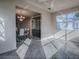 Spacious living room with views to the dining room and entry door at 507 Torres Pl, The Villages, FL 32159