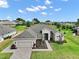 Beautiful home showcasing its roofline, landscaping, lawn and curb appeal at 5195 Greens Dr, Lady Lake, FL 32159