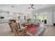 Inviting open-concept living room seamlessly connected to the kitchen, perfect for gatherings and entertaining at 5195 Greens Dr, Lady Lake, FL 32159
