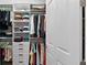 Spacious walk-in closet with built-in shelves, drawers, and plenty of room for storage at 5195 Greens Dr, Lady Lake, FL 32159