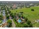 An aerial view showing the community pool, recreation areas, and surrounding neighborhood in The Villages, Florida at 530 Valencia Pl, The Villages, FL 32159