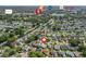 This aerial shows The Villages, FL neighborhood near shopping, dining, and grocery amenities at 530 Valencia Pl, The Villages, FL 32159