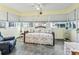 Sunroom featuring tile floors, lots of windows with blinds, and seating at 530 Valencia Pl, The Villages, FL 32159