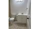 Neat bathroom featuring tiled floors and a well-maintained toilet at 601 N Mcdonald St # 408, Mount Dora, FL 32757
