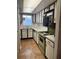 Cozy kitchen featuring a vintage stove and ample cabinet space at 601 N Mcdonald St # 408, Mount Dora, FL 32757