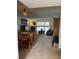 Open living area with a dining table, living room seating and access to the outdoor balcony at 601 N Mcdonald St # 408, Mount Dora, FL 32757