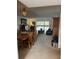Combined living and dining area with ample natural light and comfortable seating at 601 N Mcdonald St # 408, Mount Dora, FL 32757