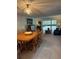 Open-concept living and dining area with a view of the outdoors at 601 N Mcdonald St # 408, Mount Dora, FL 32757