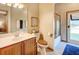 Cozy bathroom with wood accents, a tiled shower, and access to the outdoors at 605 Westview Dr, Minneola, FL 34715