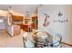 Inviting kitchen with stainless steel appliances, wooden cabinets, and decorative musical wall art at 605 Westview Dr, Minneola, FL 34715