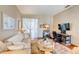 Bright living area with a couch, desk, and decorative touches creating a welcoming space at 605 Westview Dr, Minneola, FL 34715