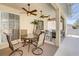 Covered patio with ceiling fans, outdoor seating, and a view of the backyard at 605 Westview Dr, Minneola, FL 34715