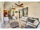 Covered patio with ceiling fans, outdoor seating, and a view of the yard at 605 Westview Dr, Minneola, FL 34715