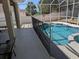 Safety first! This pool is surrounded by a safety fence, keeping your children safe when unsupervised at 605 Westview Dr, Minneola, FL 34715