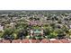 Community neighborhood pool with surrounding trees with lush foliage, a refreshing community oasis at 623 Delgado Ave, The Villages, FL 32159