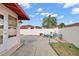 Private back patio with a stylish seating area and potted plants to give it a natural cozy environment at 623 Delgado Ave, The Villages, FL 32159