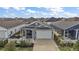 Aerial view showcasing the property's well-maintained landscaping, two-car garage and screened in porch at 6248 Siverson Ter, The Villages, FL 32163