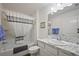 Well-maintained bathroom features tub and shower combination, marble countertop sink, and neutral color scheme at 6248 Siverson Ter, The Villages, FL 32163