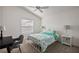 Bright bedroom features a vaulted ceiling, neutral carpet, and a comfortable full size bed at 6248 Siverson Ter, The Villages, FL 32163