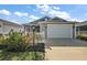 Charming single-Gathering home featuring a two-car garage, screened lanai, and beautiful landscaping at 6248 Siverson Ter, The Villages, FL 32163