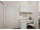 Cozy home office area features white cabinets, a marble countertop desk, and a neutral color palette at 6248 Siverson Ter, The Villages, FL 32163